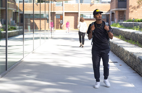 shot of student walking on campus