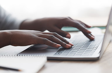 person typing on keyboard