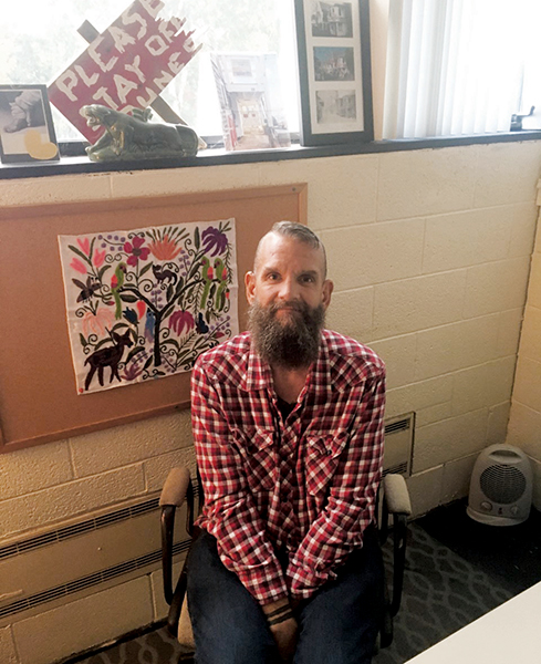 Professor Bill Berry seated in his office