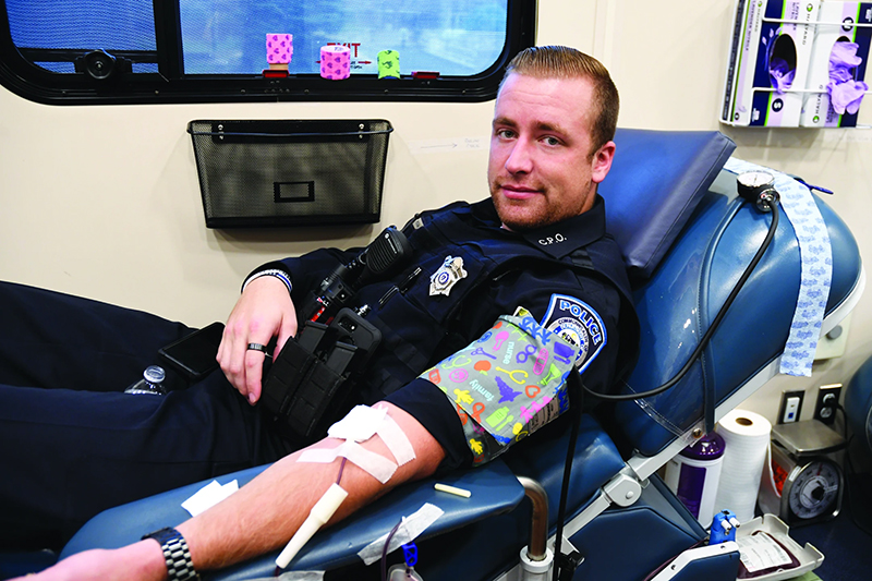 Officer David McGraw donating blood