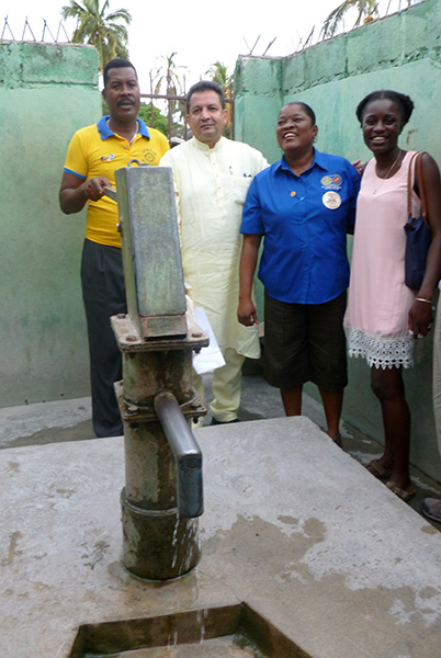 Professor VG with a student and residents of Haiti
